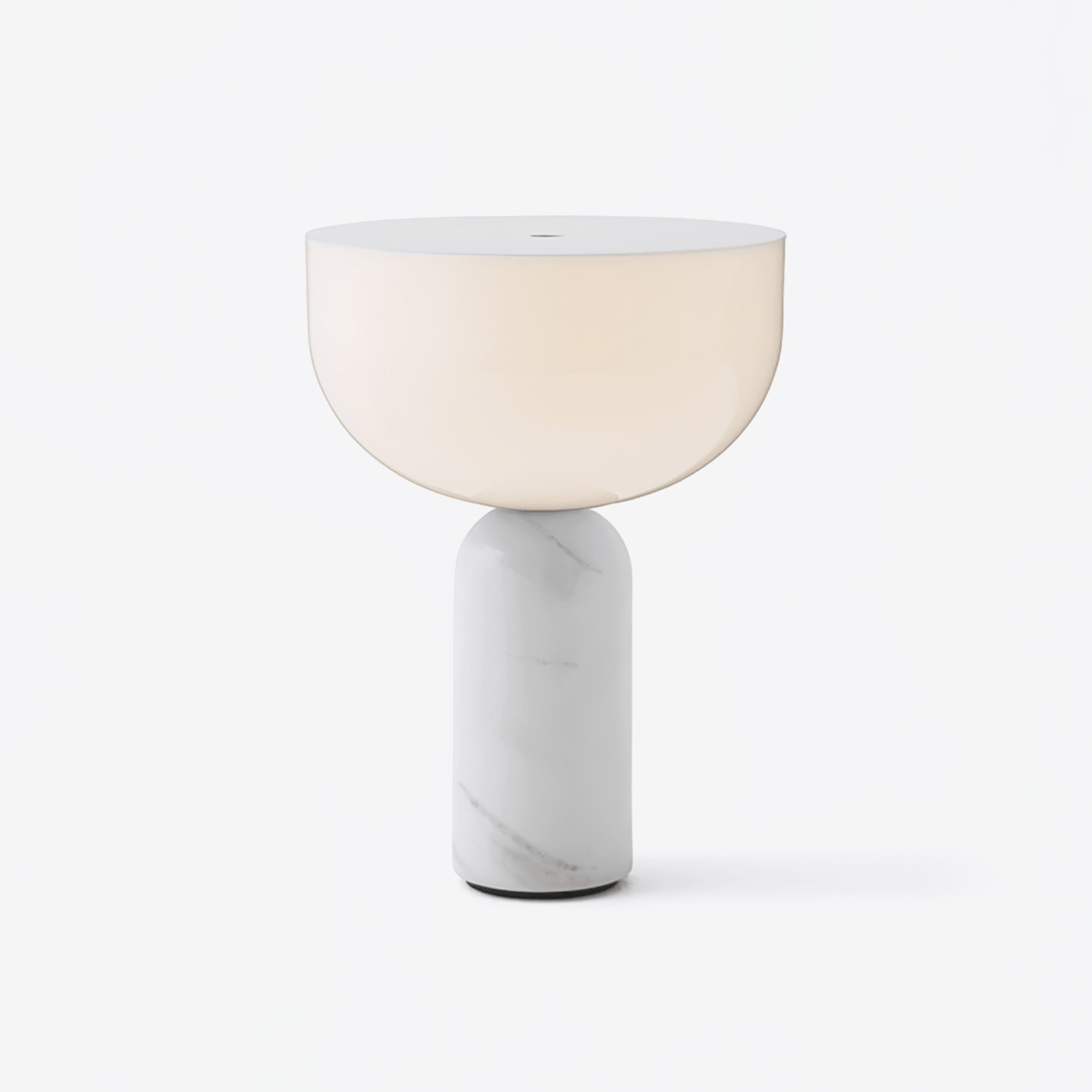 Clérachic hallway table lamp with a frosted white glass dome lit warm above a veined white marble cylinder base, shown on a plain light backdrop.