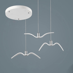 On a slate-blue backdrop, three white bird-shaped pendants from this Clérachic fixture hang from a round white canopy at staggered lengths.