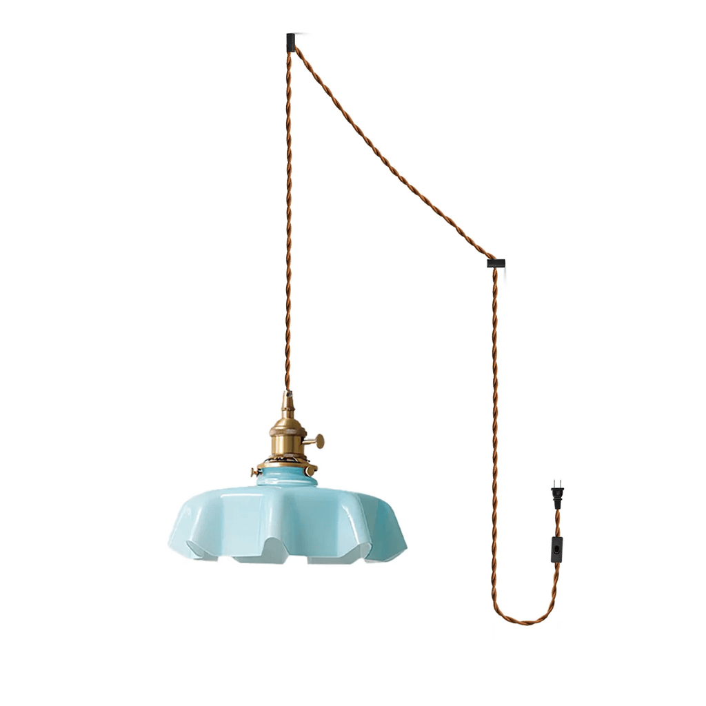The plug-in diagram for this Clérachic pendant shows a twisted brown cord running from ceiling hook to wall plug, ending in the blue shade.