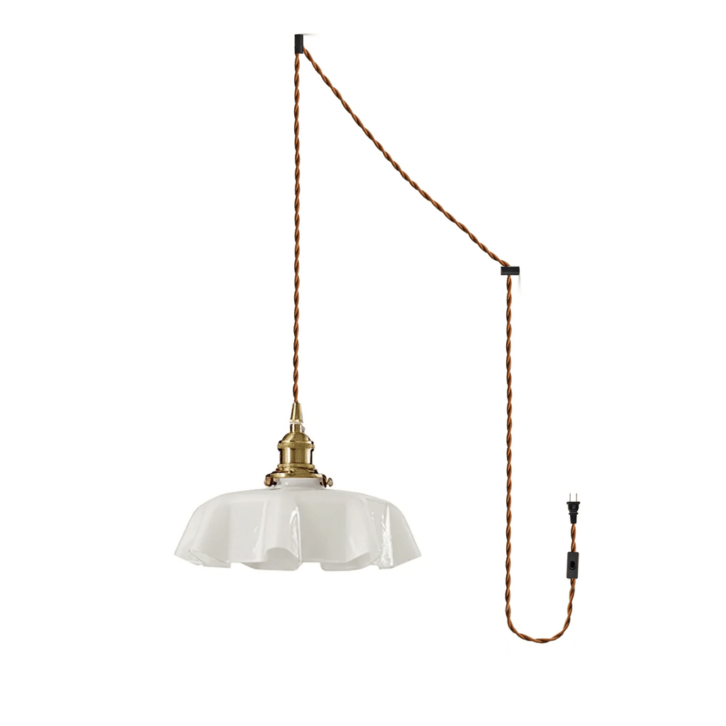The plug-in diagram for this Clérachic pendant shows a twisted brown cord running from ceiling hook to wall plug, ending in the white shade.