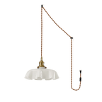The plug-in diagram for this Clérachic pendant shows a twisted brown cord running from ceiling hook to wall plug, ending in the white shade.