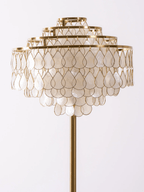 Close view of the layered mother-of-pearl petals forming this Clérachic floor lamp's tiered shade.