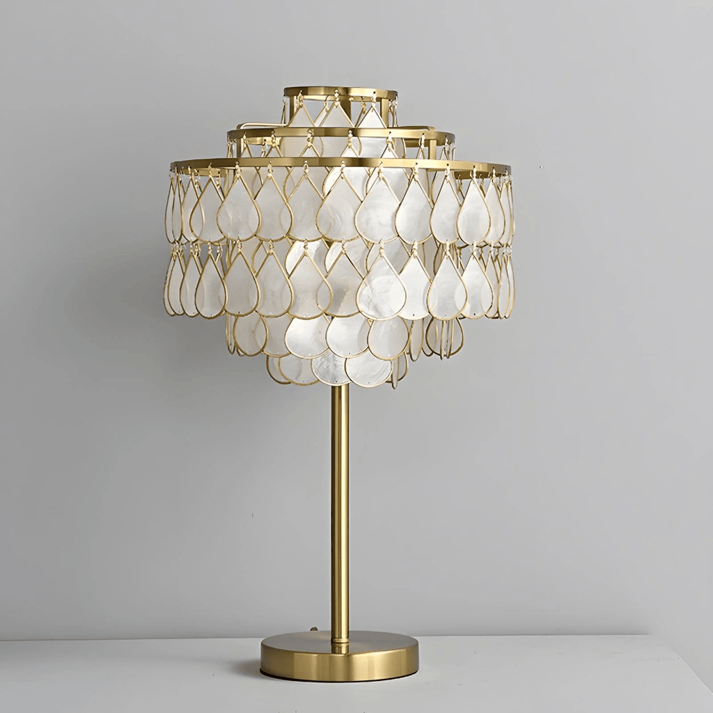 Clérachic table lamp with a brass base, an isolated product shot softly lit against a plain background.