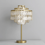 Clérachic table lamp with a brass base, an isolated product shot softly lit against a plain background.