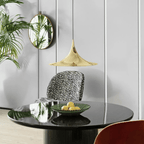 Two arch pendant lights paired above a long table