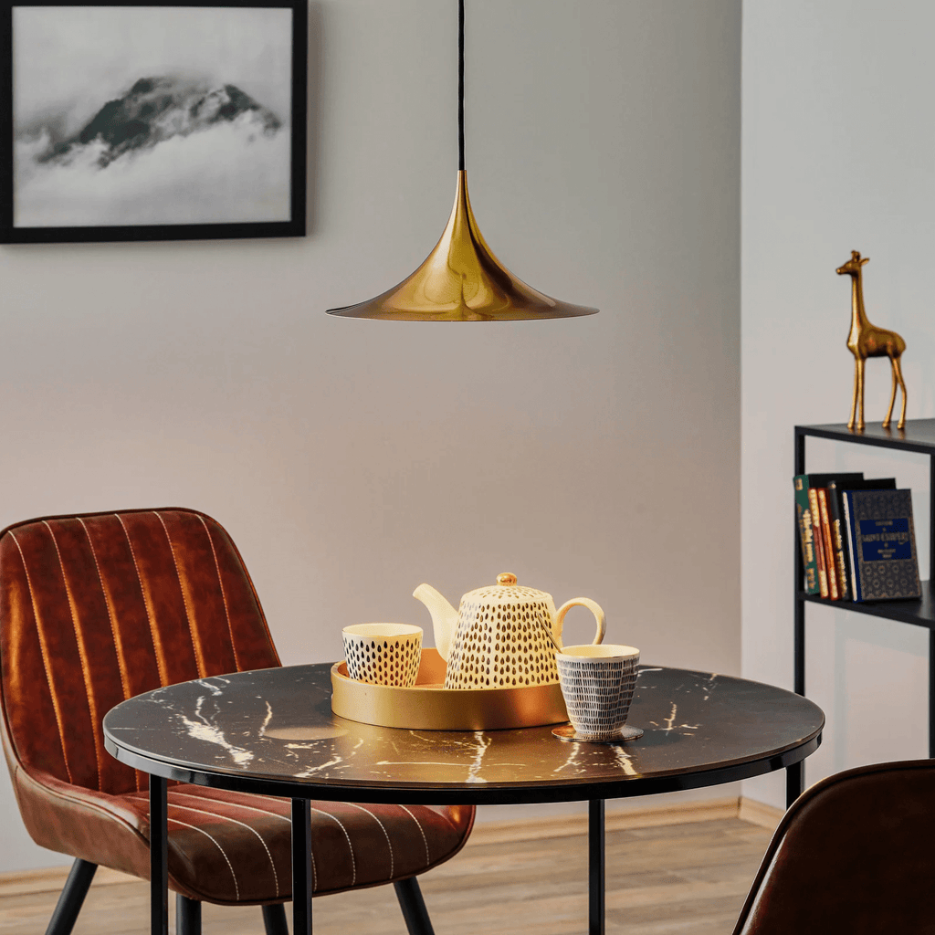Arch pendant light over a kitchen counter with stools