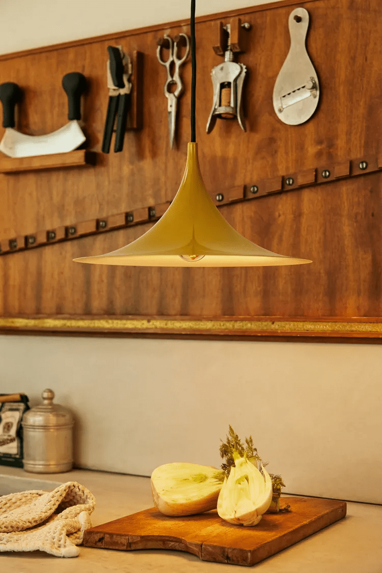 Cluster of arch pendant lights at staggered heights