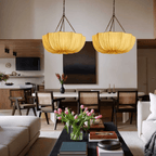 Cotton pendant light with black frame in a soft-lit lounge