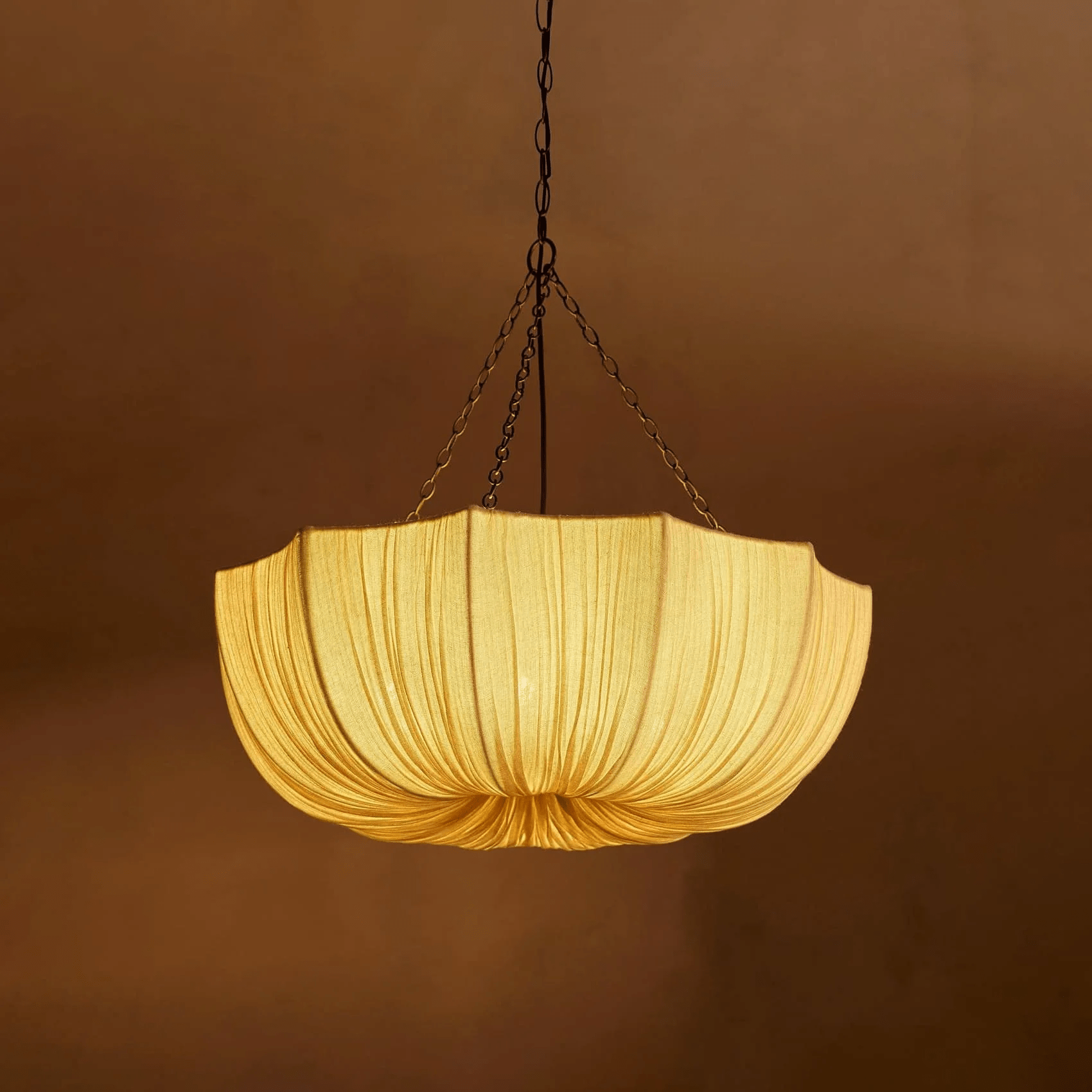 Gathered cotton pendant light shown in a refined interior