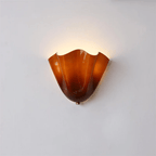 Petalia wall sconce sculptural glass curve viewed from the side