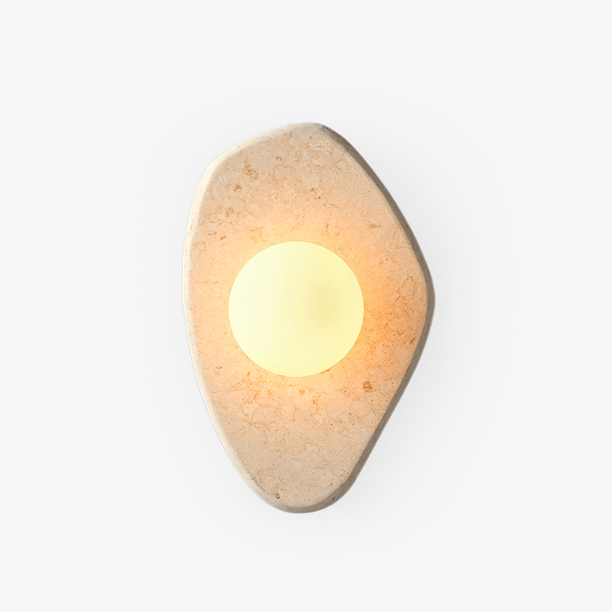 Beige carved-marble wall light with a glowing white glass orb from Clérachic, on a plain white studio background.