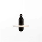 Close view of the black Orion pendant's ribbed stem and ball fitting above the alabaster disc.