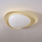 In beige, a colour this Clérachic ceiling light comes in, its resin shell glows warm around the white diffuser.