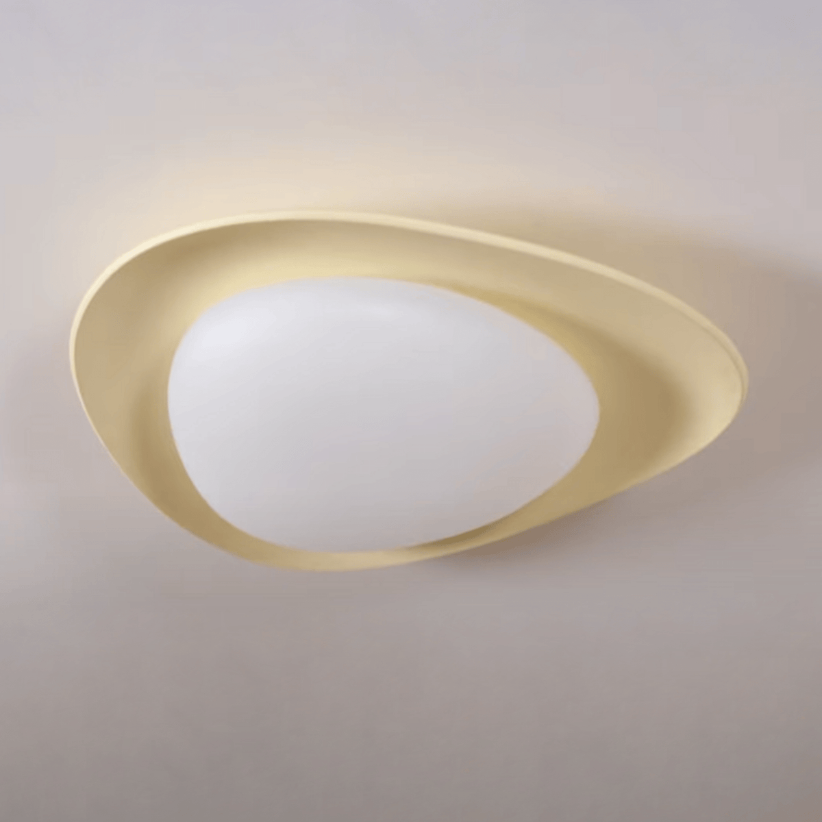 In beige, a colour this Clérachic ceiling light comes in, its resin shell glows warm around the white diffuser.