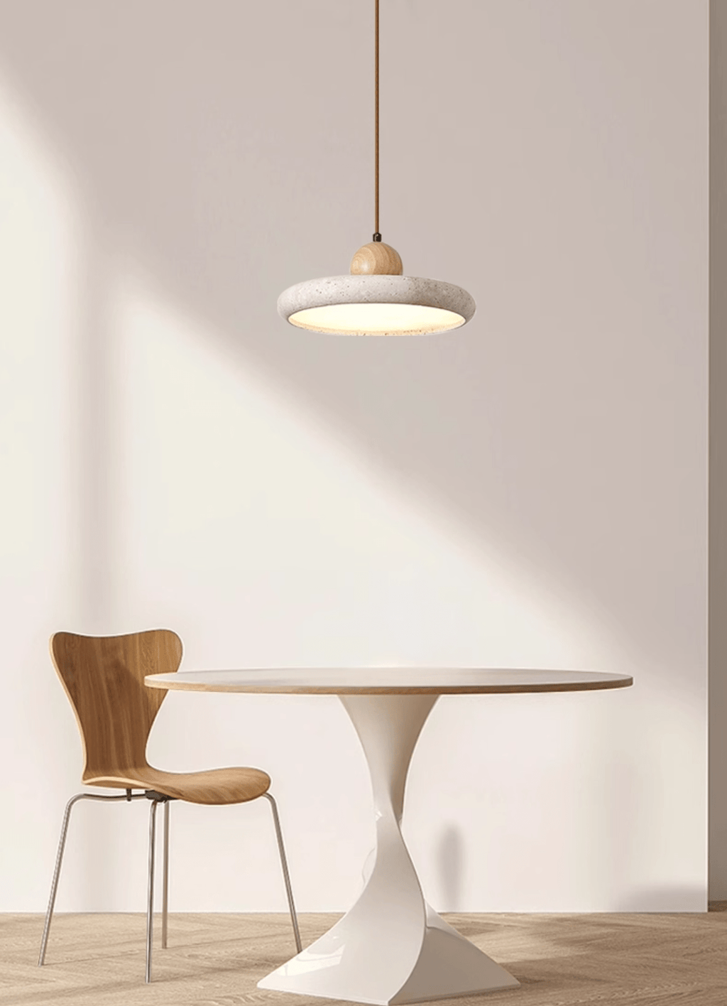 Travertine stone pendant light glowing in a cosy interior scene