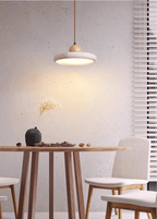 Travertine pendant light in neutral white light in a modern room