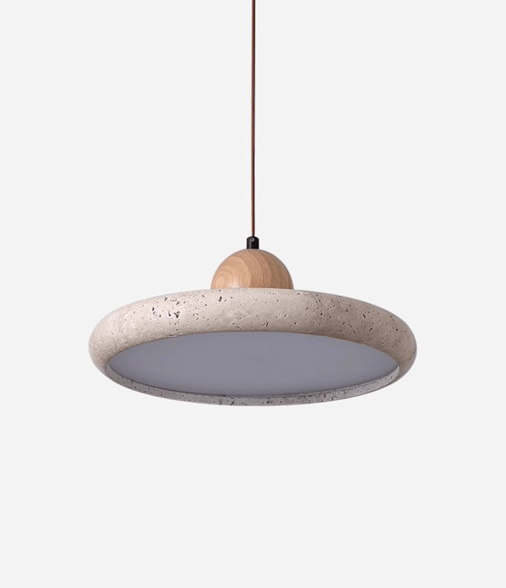 Natural stone travertine pendant light lit in a calm interior