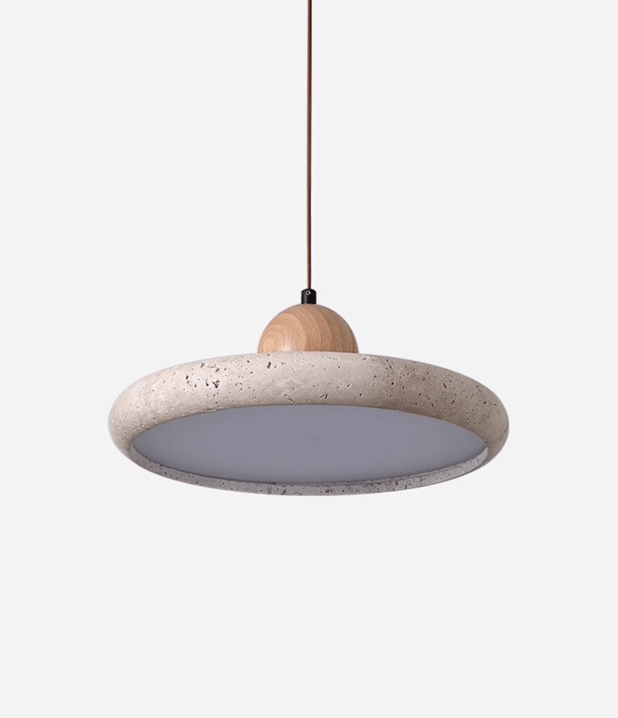 Natural stone travertine pendant light lit in a calm interior