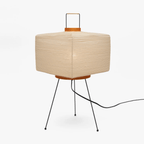 White paper lantern table lamp in a softly lit room