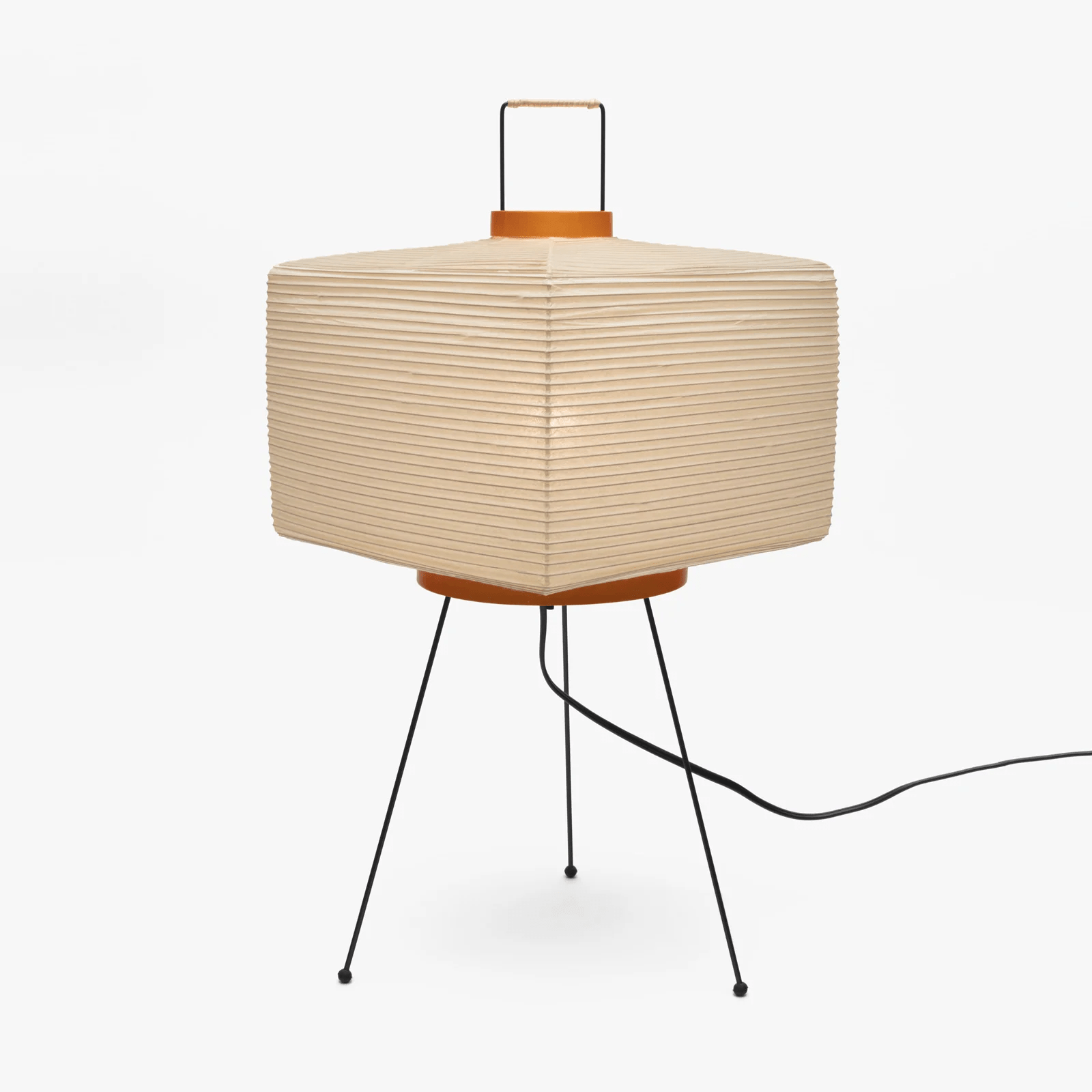 White paper lantern table lamp in a softly lit room