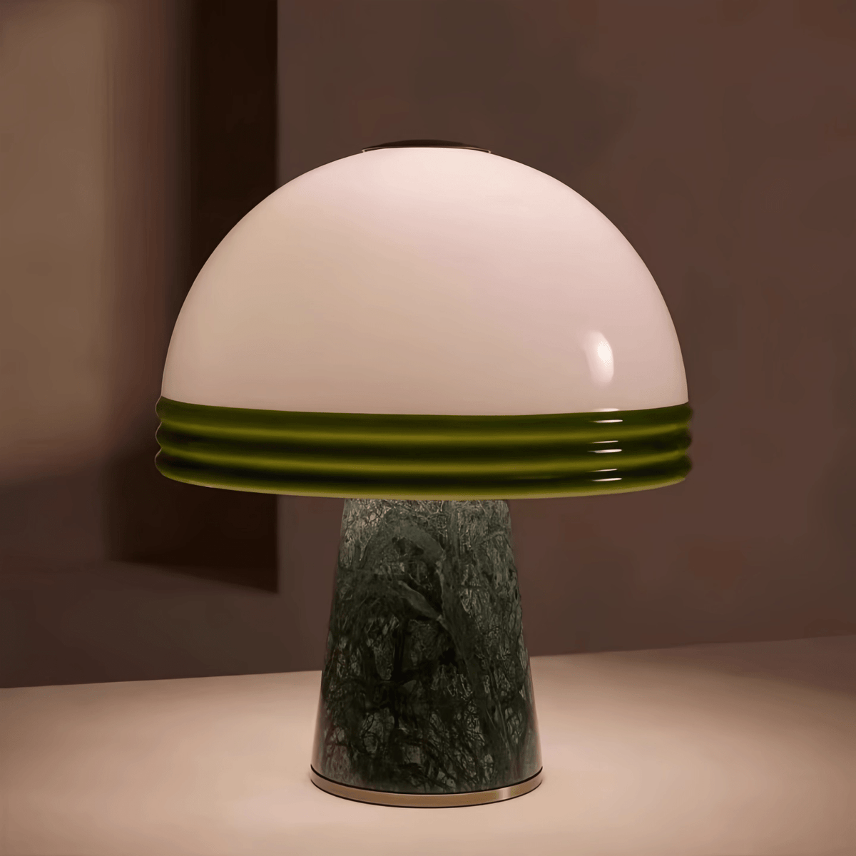Clérachic dome table lamp photographed against a warm terracotta backdrop, showing the full green-rimmed shade and marble base.