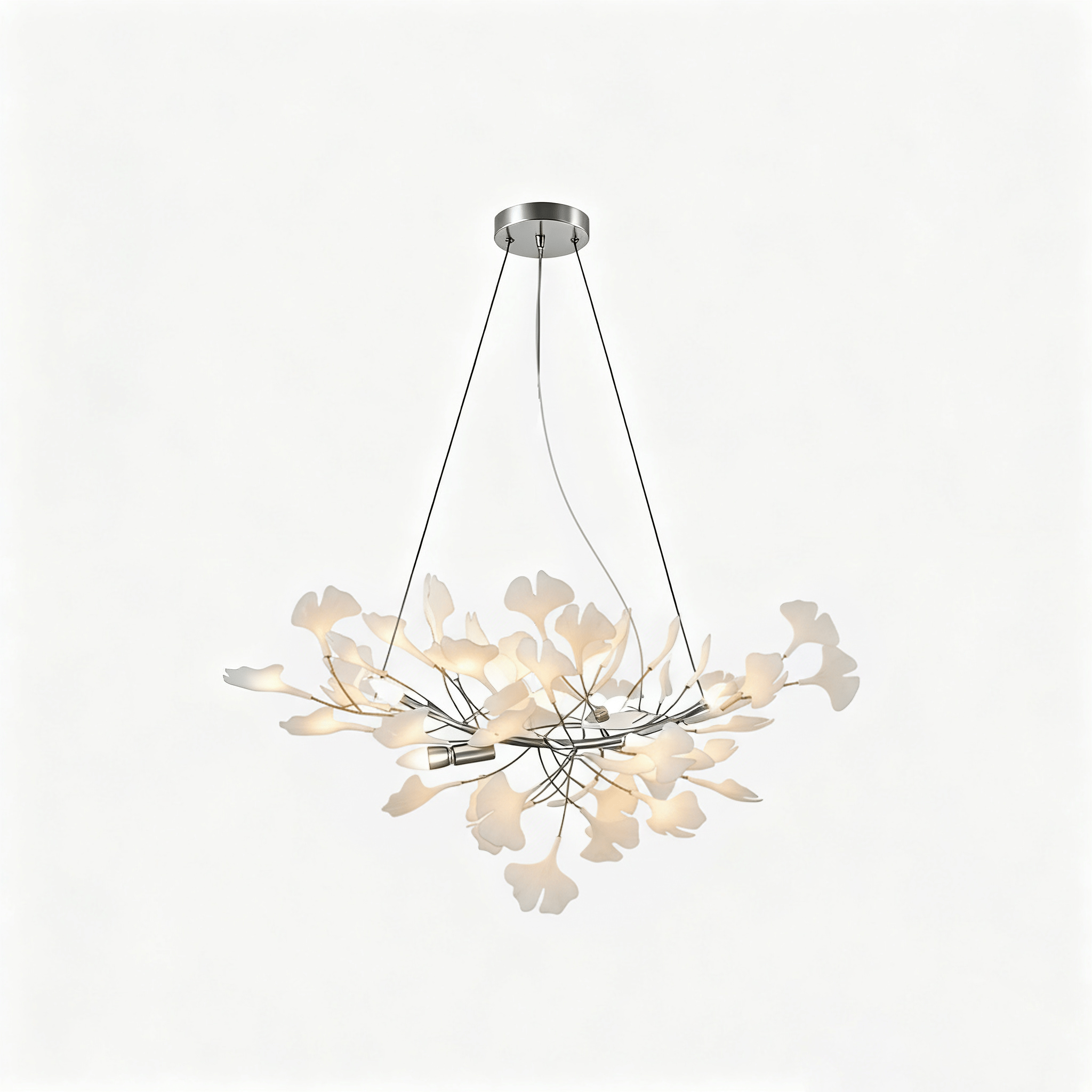Porcelain leaf chandelier casting warm light in an elegant room
