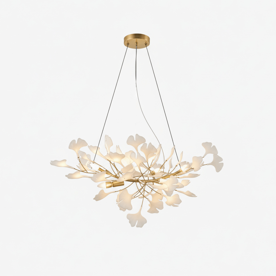 Gingko leaf chandelier with porcelain leaves glowing over a dining area