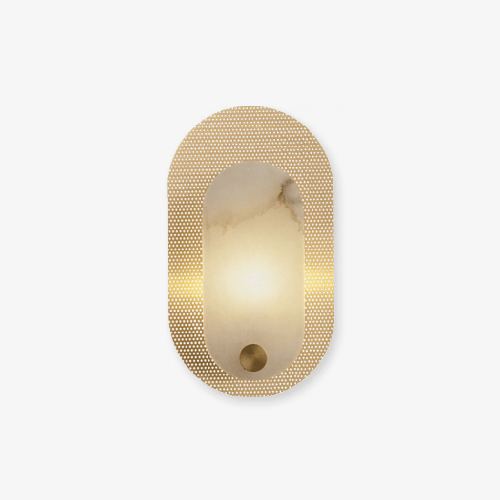 Perforated brass oval wall light on white, a lit alabaster panel set into the punched metal plate.
