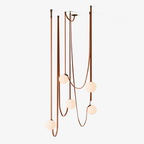 Multiple Belt Art Pendant Light hanging in a styled interior