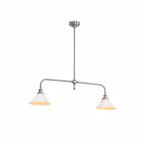 Warm light glows from both shades of this nickel-finish Clérachic pendant, shown on a white background.