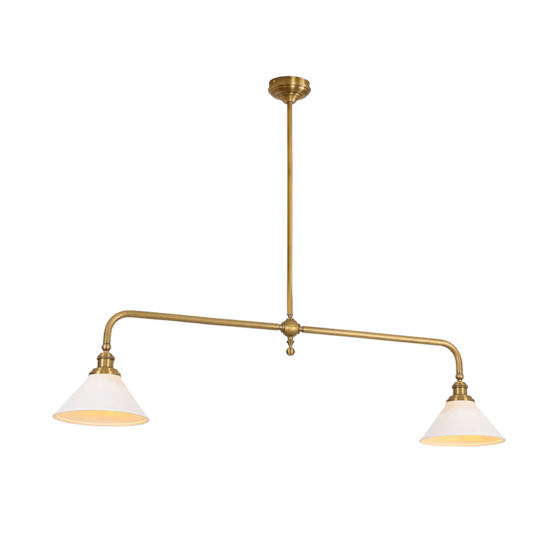 This brass-finish Clérachic pendant glows warm on white, its arms swept wide to two matching shades.