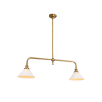 In a brass finish, this Clérachic pendant sits unlit on a white background, its two shades hanging level.