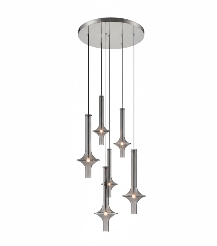 Six Clérachic pendants in smoky grey glass cascade at staggered heights from a round canopy, lit against a white backdrop.