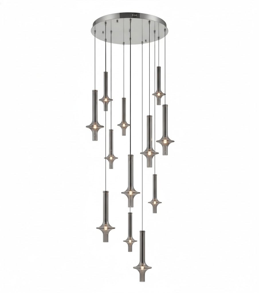 A tall cascade of Clérachic pendants in dark pewter-toned glass drops through several tiers from a round canopy, lit against white.