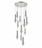 A cascade of Clérachic pendants in dark graphite-toned glass drops from a round canopy in tiers, lit against a white backdrop.