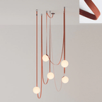 Multiple Belt Art Pendant Light shown in a sculptural multi-head arrangement