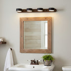 Travertine wall sconce with warm light against dark wall