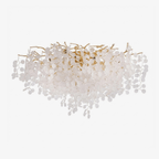On a plain white background, this Clérachic ceiling light spreads its gold branches wide beneath a dense cluster of frosted glass discs.
