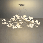 Brass branch chandelier with porcelain leaves from below