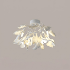 Gold ginkgo ceiling light seen from below against ceiling