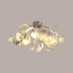 White ceramic leaf shades around bright globe bulbs