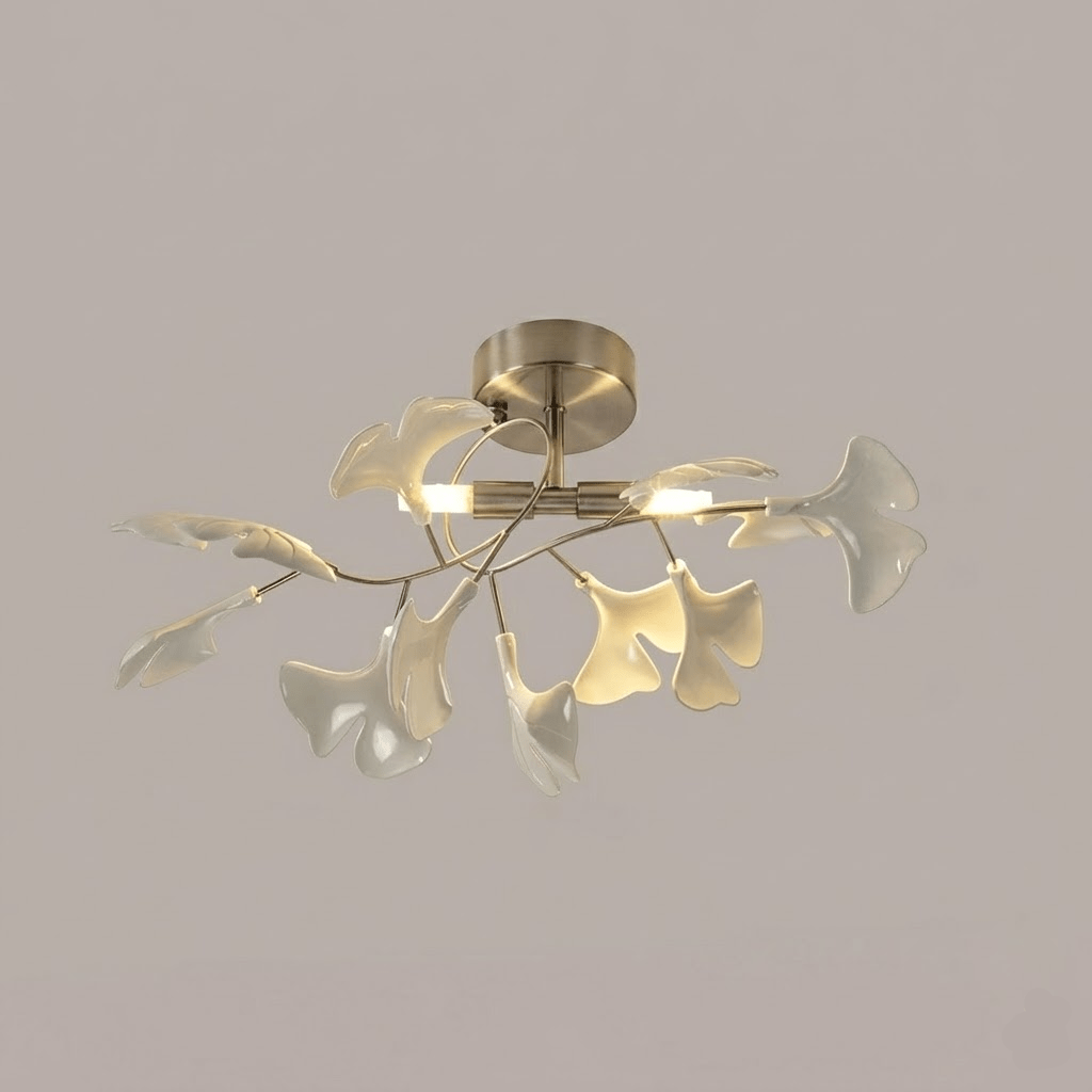 White ceramic ginkgo leaves fanned around glowing G9 globes