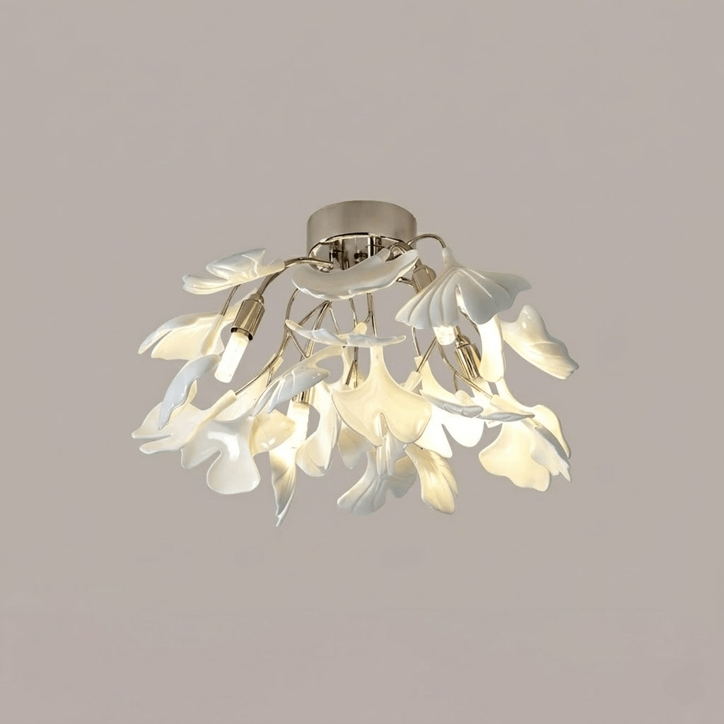 Close view of white ceramic leaves catching warm light
