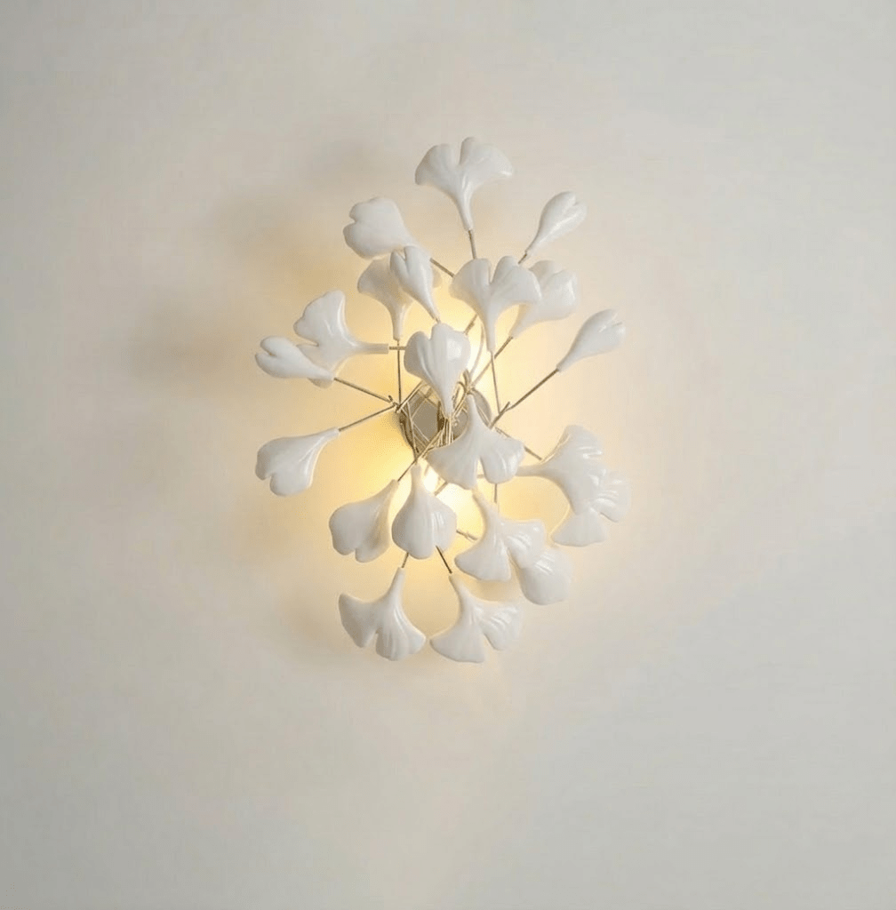 White ceramic ginkgo leaves arranged on a wall fixture