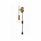 Clérachic plug-in wall lamp on white, small pale marbled beads above a lit glass globe and a corded plug.