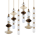 Cluster of glass pendant lights with gold bodies glowing