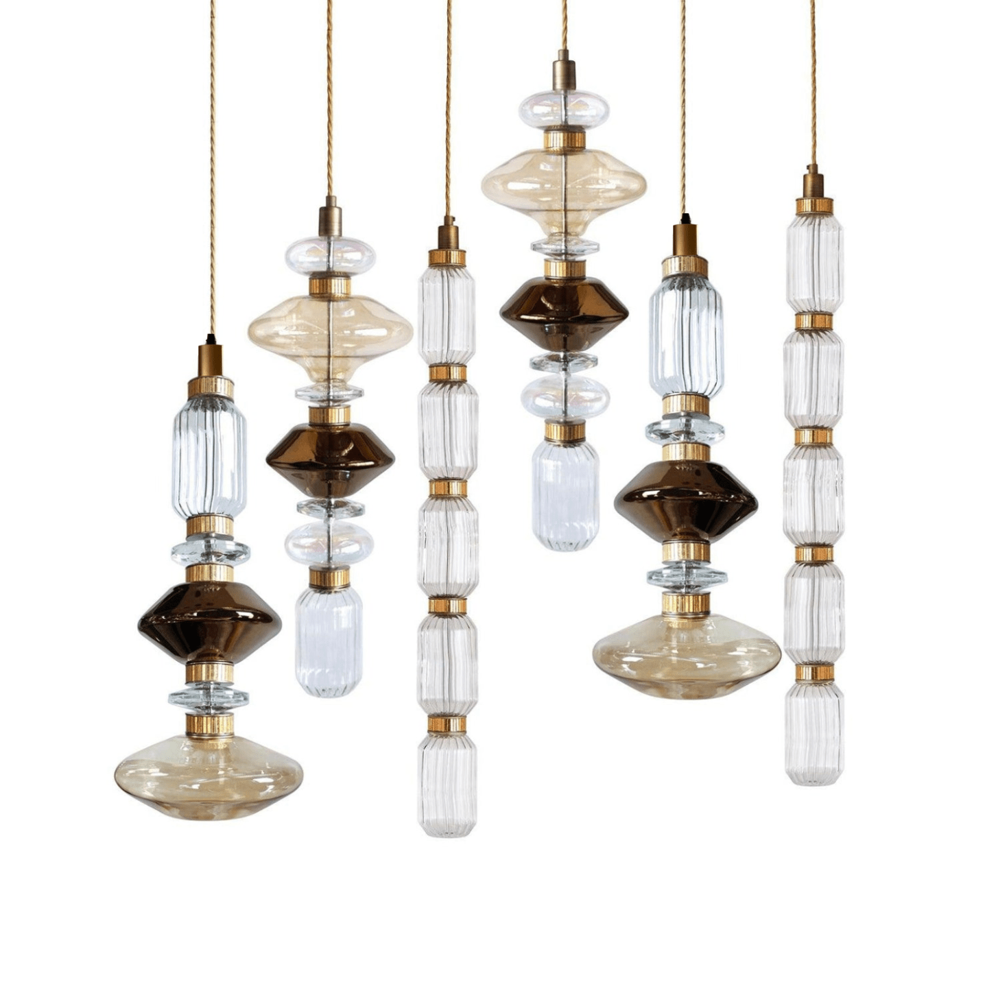 Cluster of glass pendant lights with gold bodies glowing