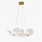 Gold leaf chandelier lit warmly against a dark ceiling