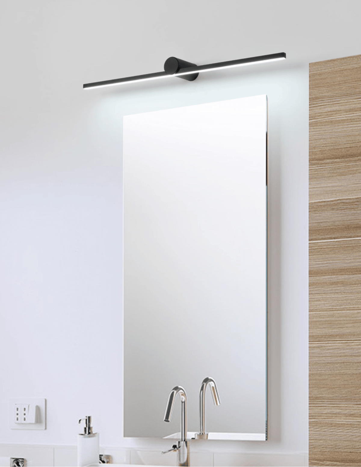 This Clérachic wall light glows above a full-length mirror set against wood panelling near a bathroom sink.