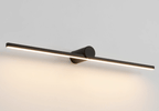 Studio shot of a Clérachic wall light glowing warm at a slight angle against a dark backdrop.